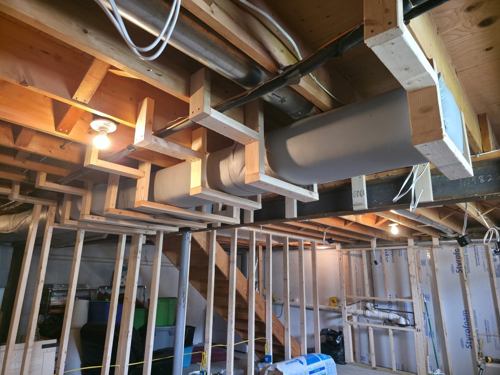 Basement ceiling framing around ducts and pipes