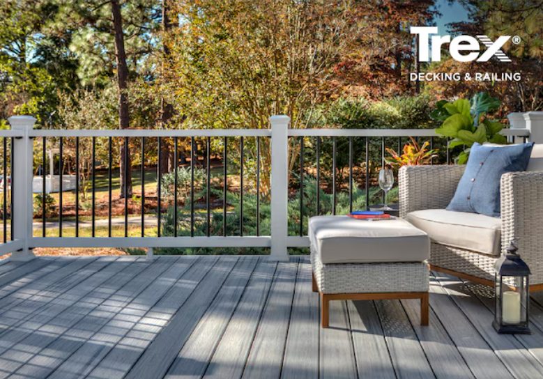 Composite deck with wood-tone boards and black balusters overlooking a yard
